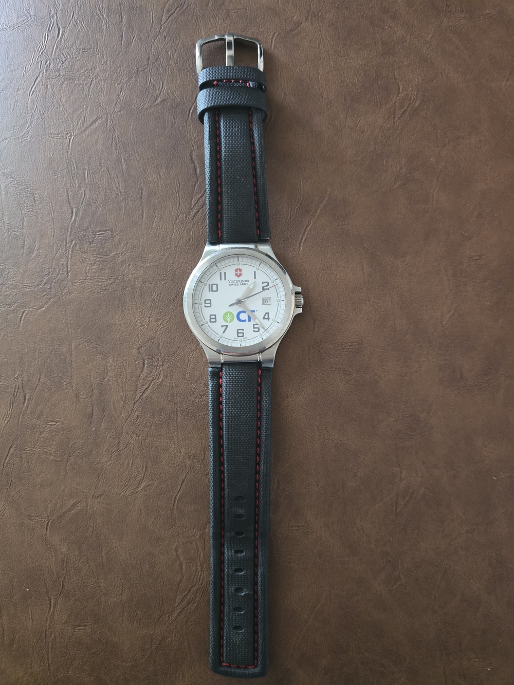 Victorinox-Inspired Silver Round Watch with Black Strap and Red Stitching